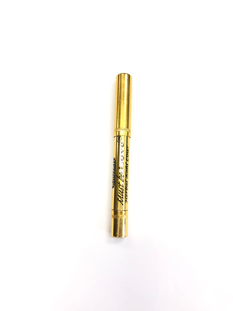 natural kohl that twists up in a gold packaging