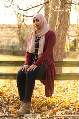 a hijabi wearing a modest cardigan with pockets, grid top, and chiffon hijab from bella hijabs