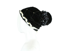 velvet bonnet cap turban with jewels and a floral embellishment 