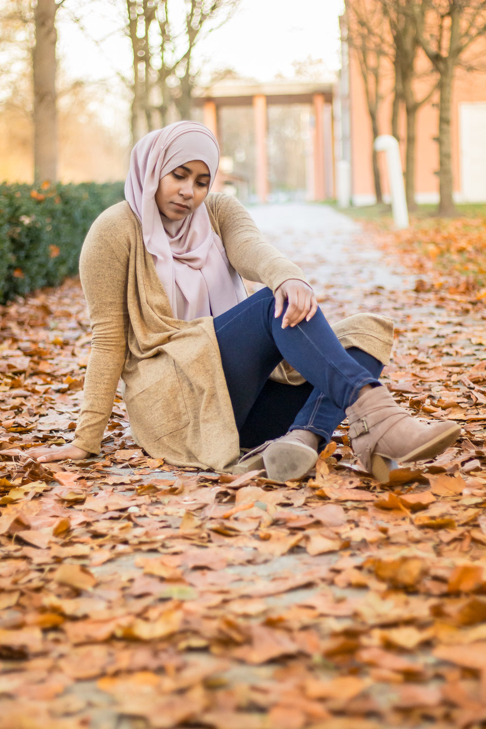 a hijabi wearing a modest cardigan with pockets and chiffon hijab from bella hijabs