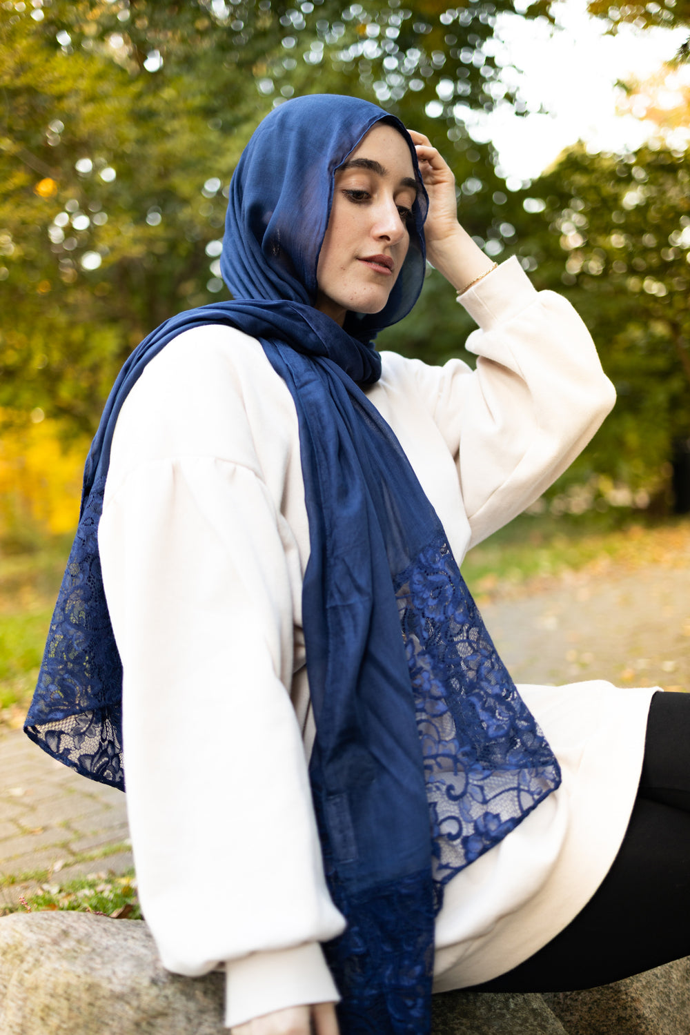 solid navy hijab made with modal fabric and embellished with lace at the ends