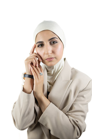 muslim woman wearing a beige blazer and ivory cream ninja underscarf