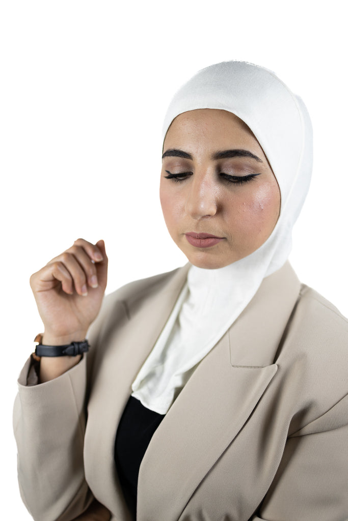 muslim woman wearing a beige blazer and off white ninja underscarf