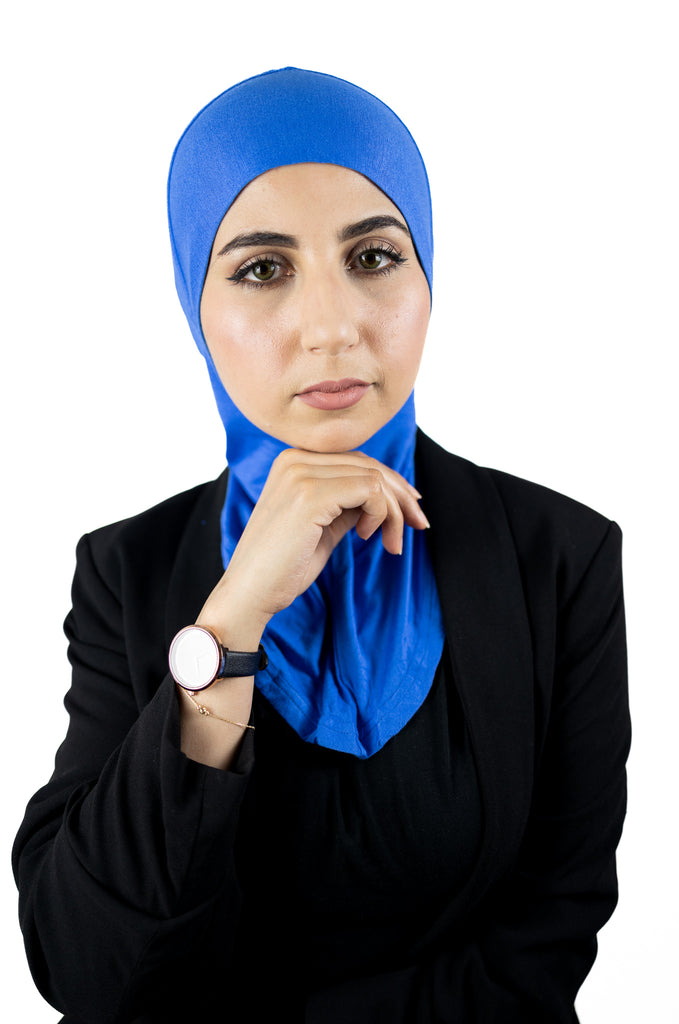 muslim woman wearing a black blazer and royal blue ninja underscarf