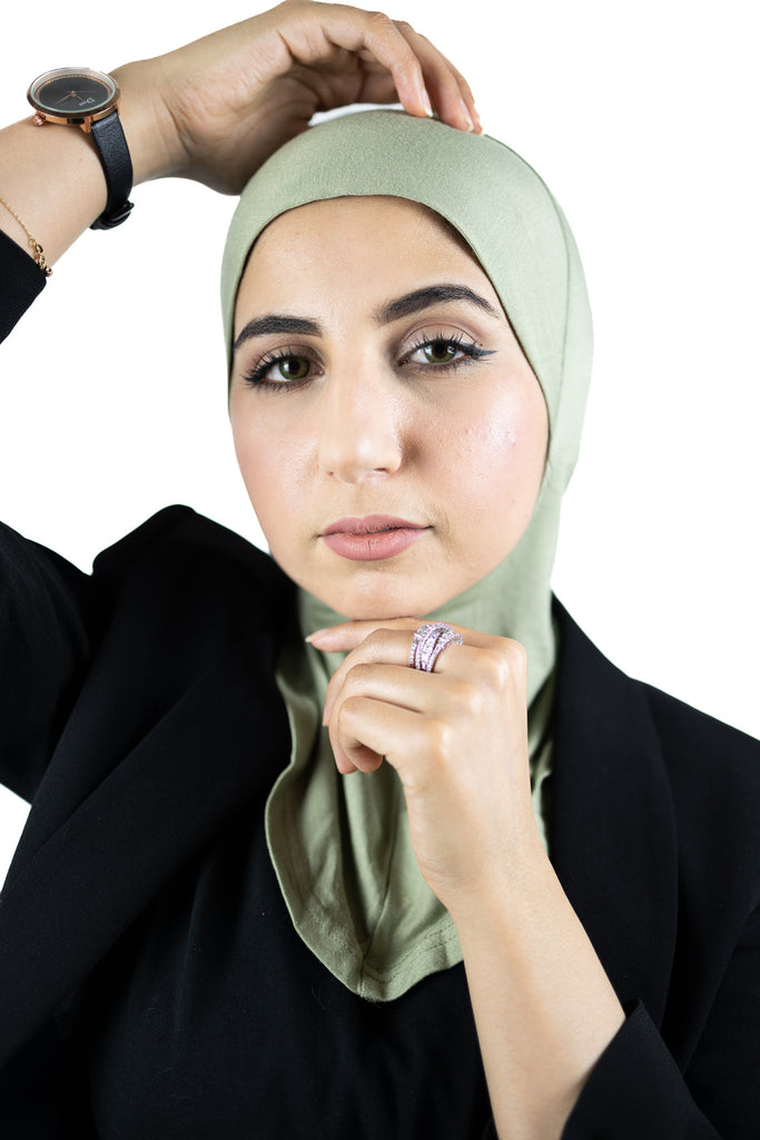 muslim woman wearing a beige blazer and lime cream ninja underscarf