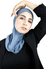 muslim woman wearing a beige blazer and night sky blue ninja underscarf
