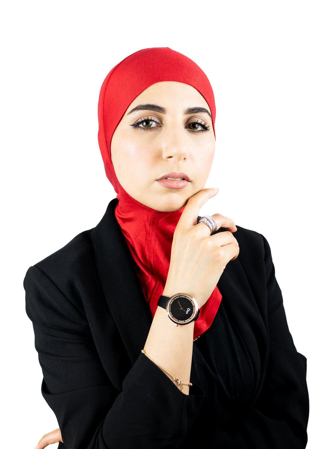 muslim woman wearing a beige blazer and red ninja underscarf