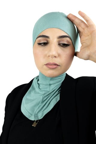 muslim woman wearing a beige blazer and mint cream ninja underscarf