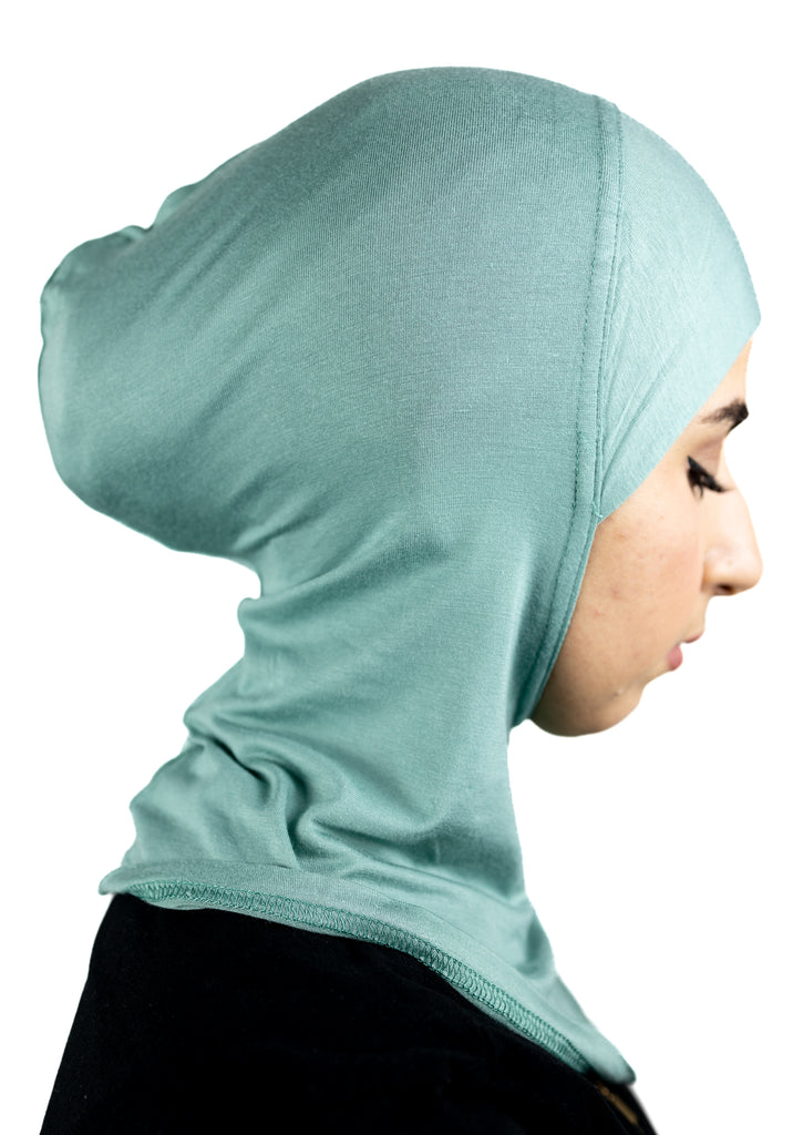 muslim woman wearing a beige blazer and mint cream ninja underscarf