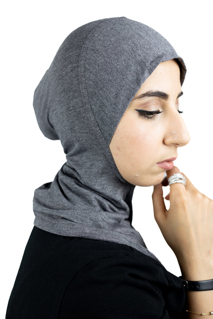 muslim woman wearing a beige blazer and heather gray ninja underscarf