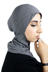 muslim woman wearing a beige blazer and heather gray ninja underscarf