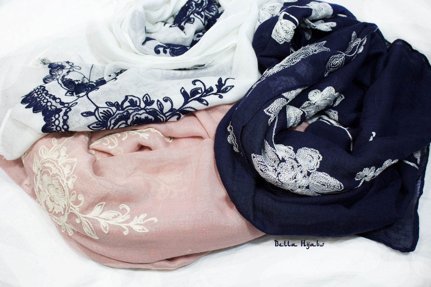 bundle of three floral embroidery hijabs in white, blush pink, and navy blue