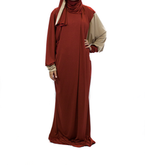 tan and burnt orange one piece prayer abaya with sleeves and a wrap on attached hijab