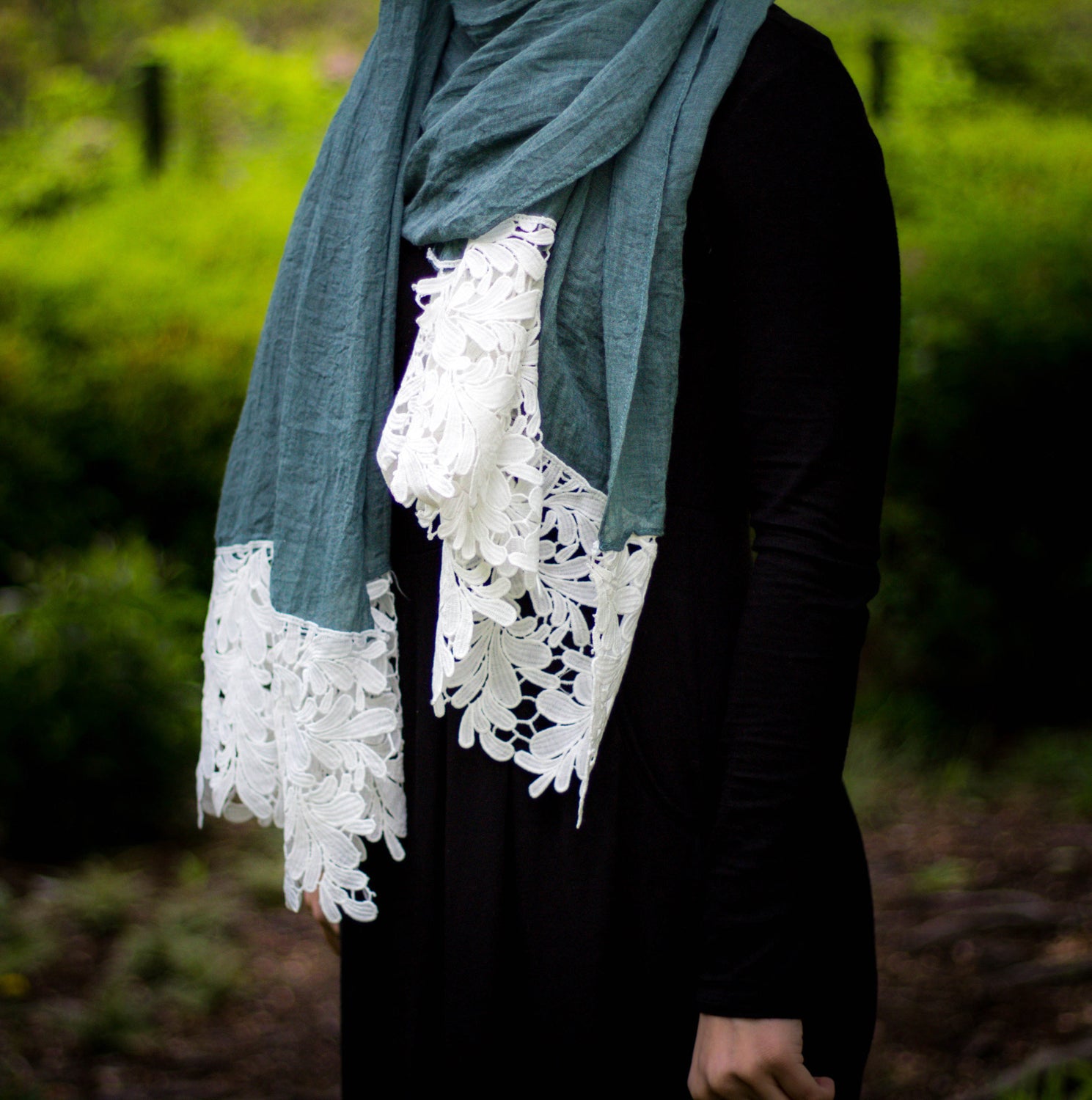 emerald green viscose hijab with white embroidery lace on the ends
