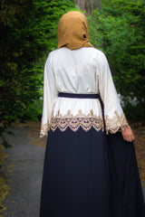 black and creme two toned abaya with gold trim and waist tie