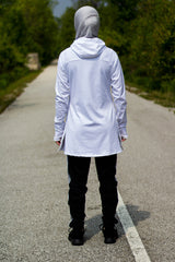 white workout top with long sleeves and a hijab attached with a gray jersey hijab