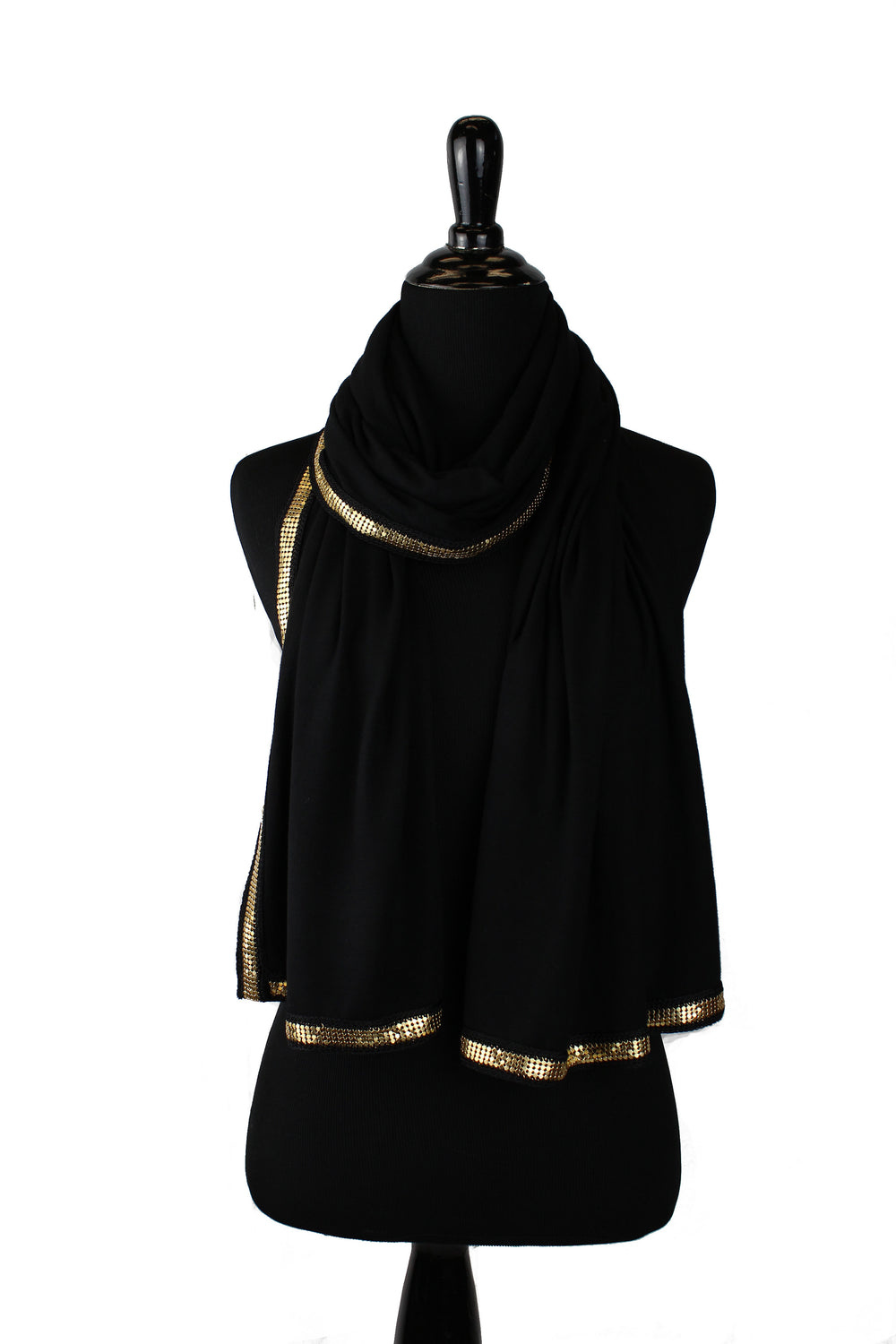 black jersey hijab embellished with a gold trim along the edges