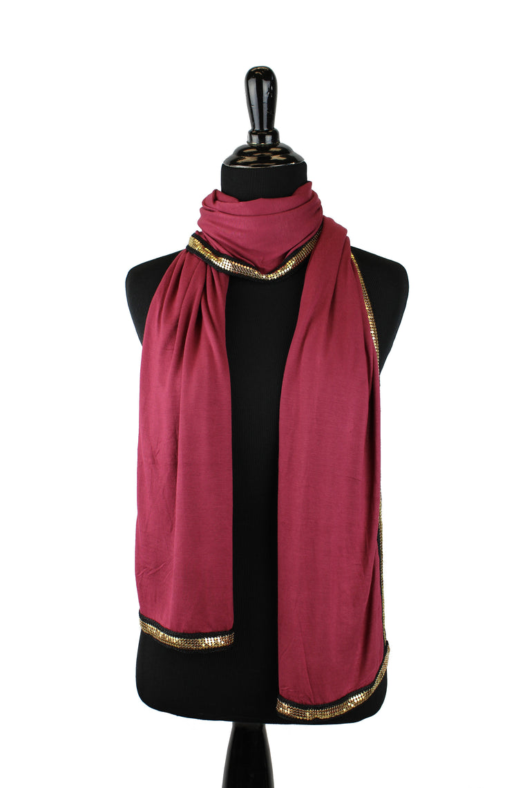 maroon jersey hijab embellished with a gold trim along the edges