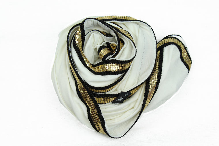 white jersey hijab embellished with a gold trim along the edges