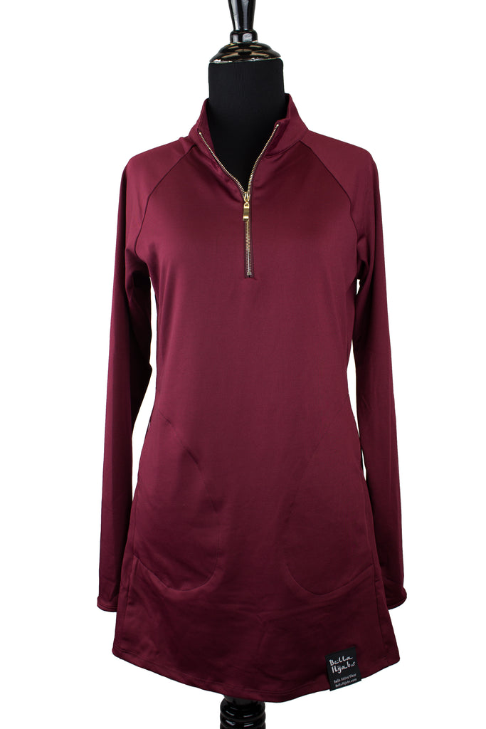 long sleeved workout top in maroon with a gold zipper