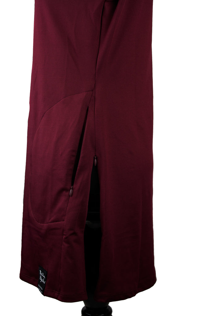 side zippers on a maroon long sleeve work out top