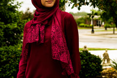 solid burgundy hijab made with modal fabric and embellished with lace at the ends