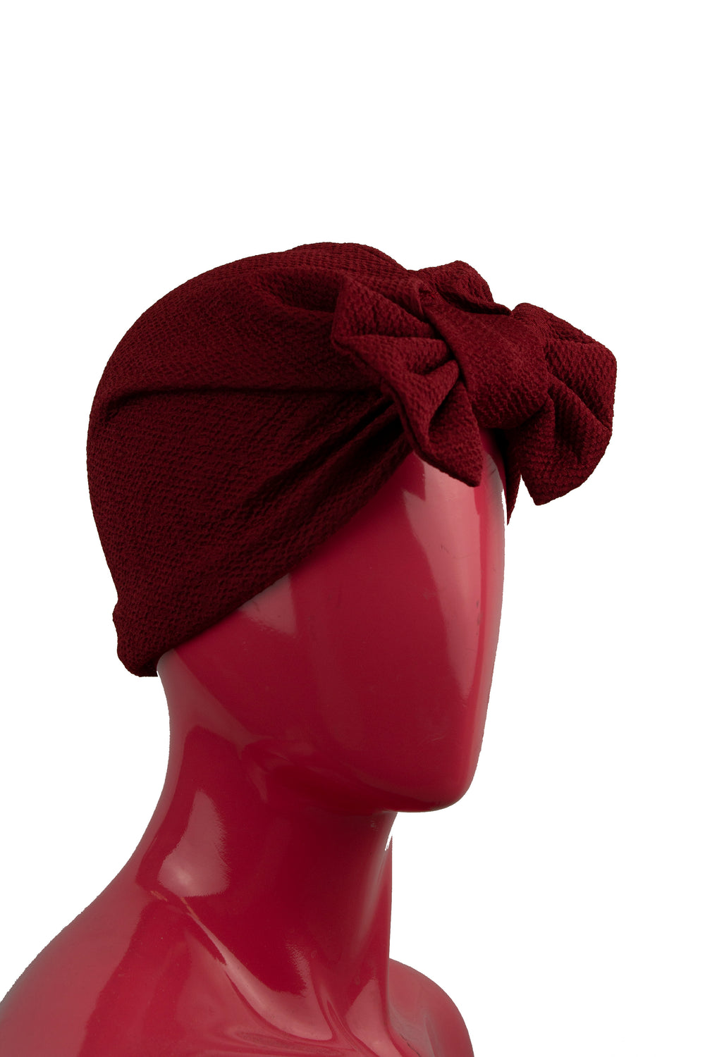 maroon slip on turban with a large bow on the front