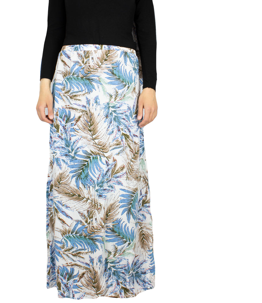 two piece salah outfit with hijab and skirt printed with blue, white, and beige leaves