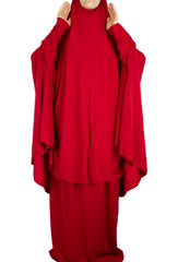red two piece prayer set with a long khimar that covers to the knees and a maxi skirt