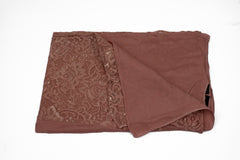 solid mauve hijab made with modal fabric and embellished with lace at the ends