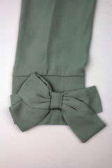 large bow on mint blouse