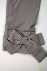 large bow sleeve on a gray blouse