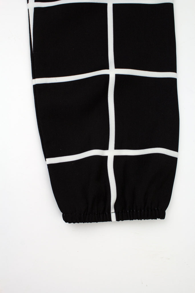 sleeve with stretchy wrist on black and white grid shirt
