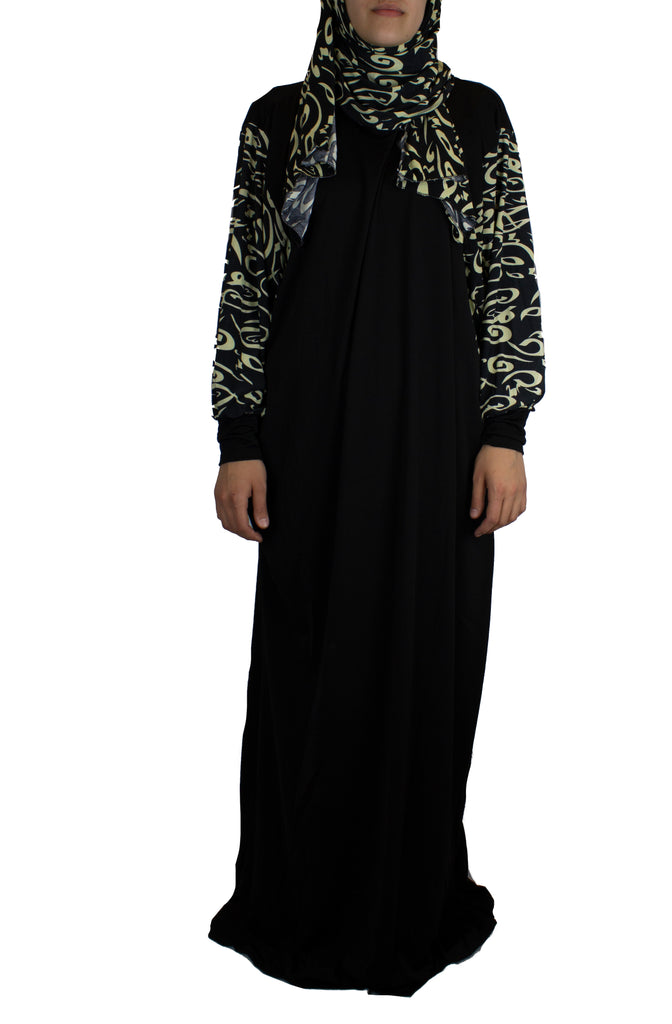 tan and black one piece prayer abaya with sleeves and a wrap on attached hijab with calligraphy print
