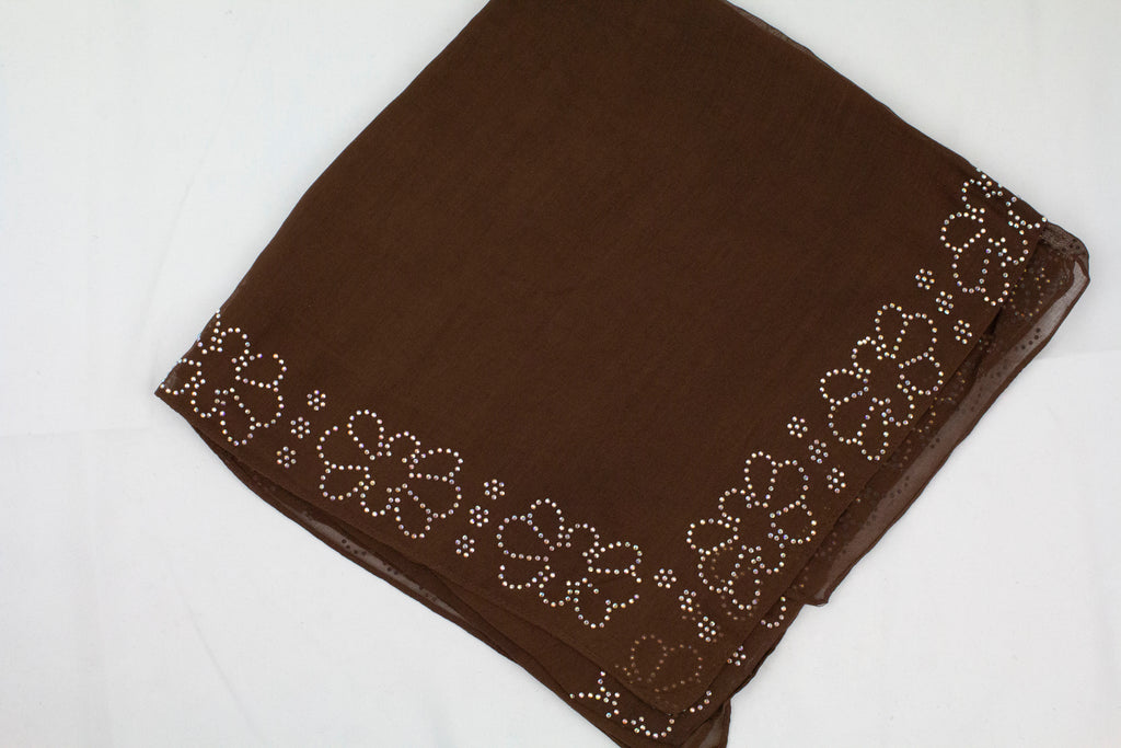 brown square hijab with jewels along the edges in a floral pattern