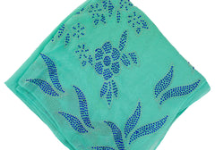 teal square hijab with blue jewels in a floral pattern