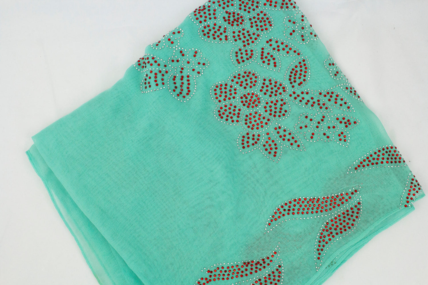 teal square hijab with red jewels in a floral pattern
