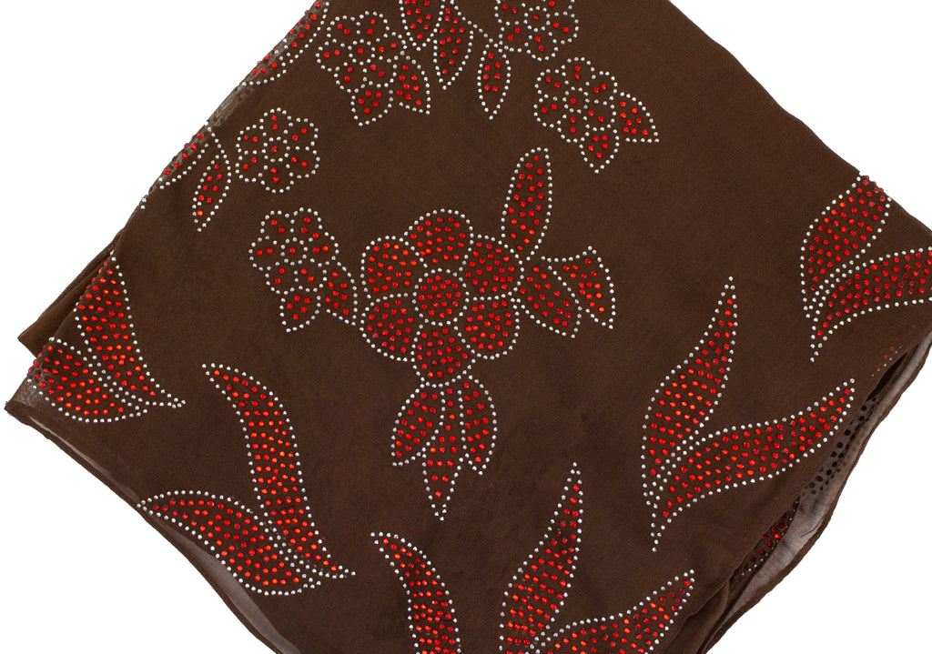 brown square hijab with red jewels in a floral pattern