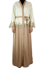 creme and tan two toned abaya with gold trim and waist tie