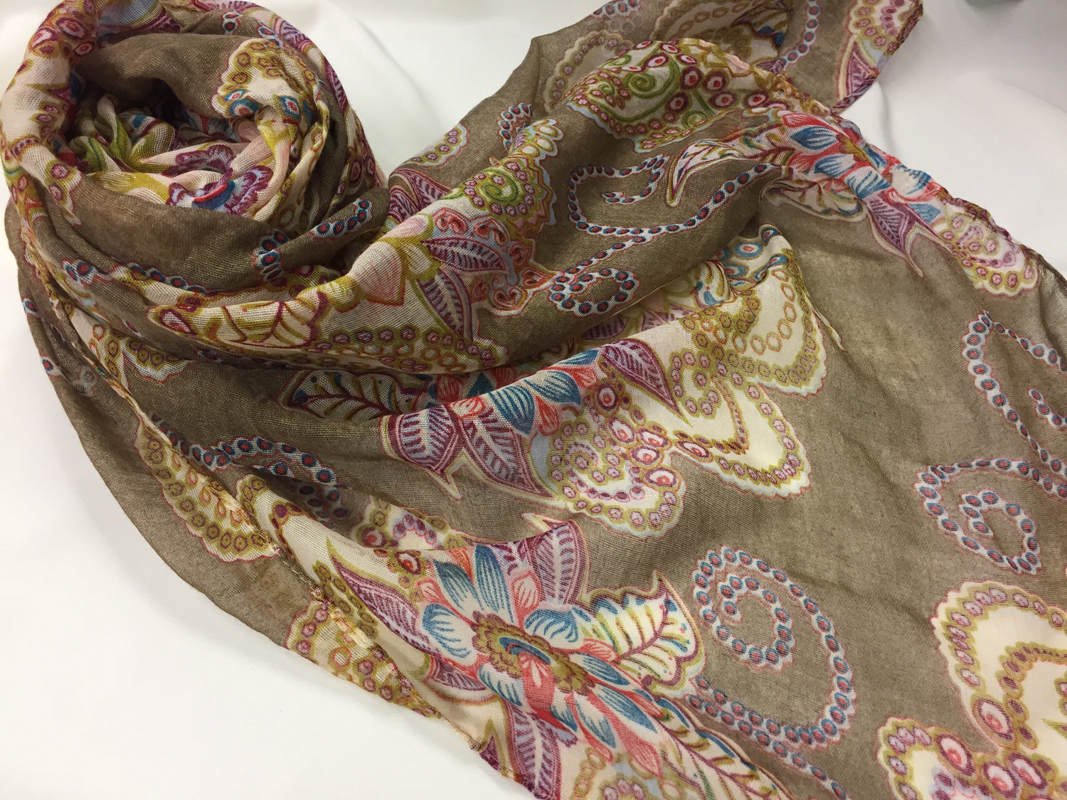brown hijab with paisley print in creme pink and purple