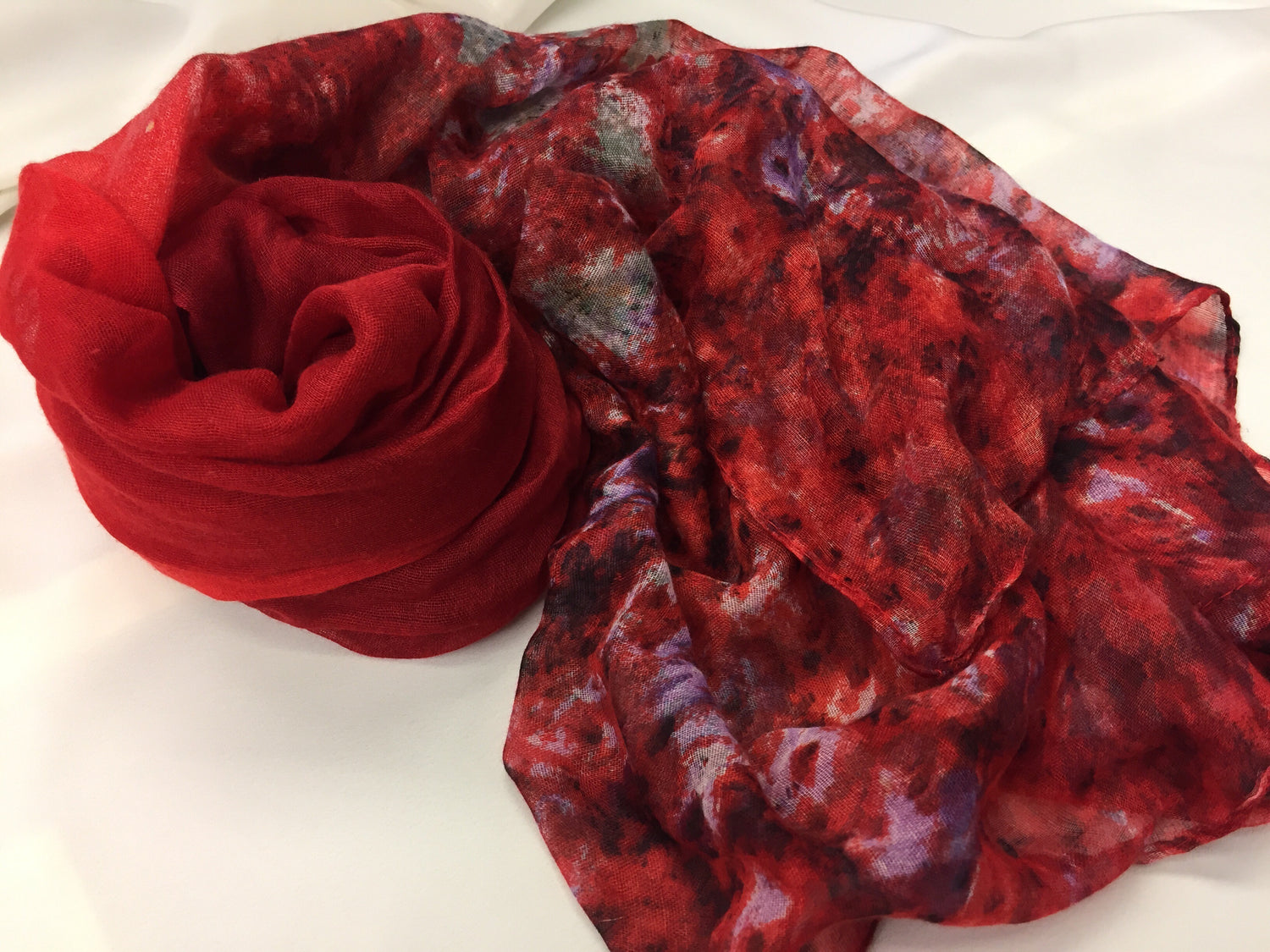 red hijab with floral mixed print at the ends