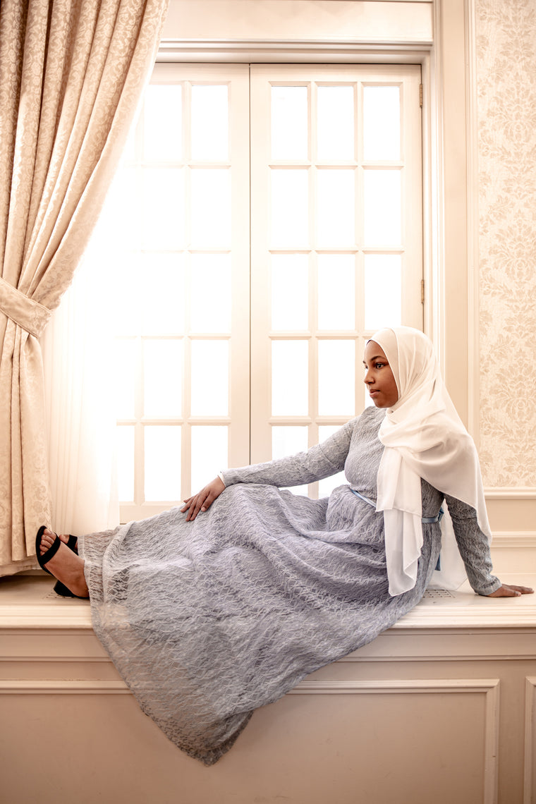 long sleeve maxi dress in baby blue lace with a satin waist tie