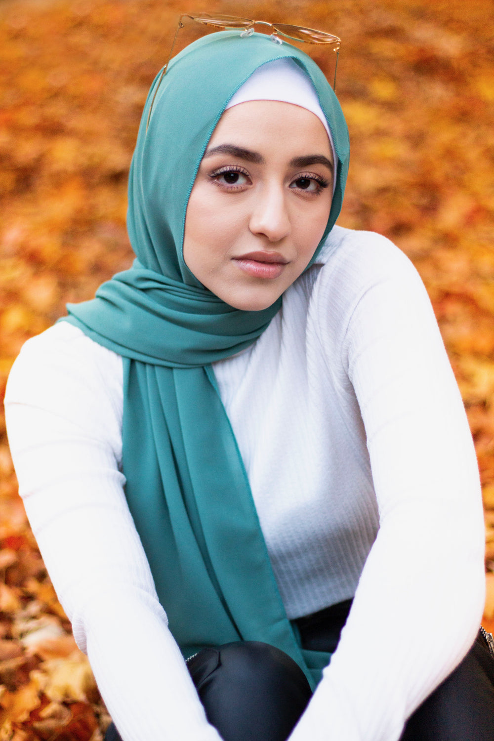 turquoise chiffon hijab and white top and leather skinny jeans
