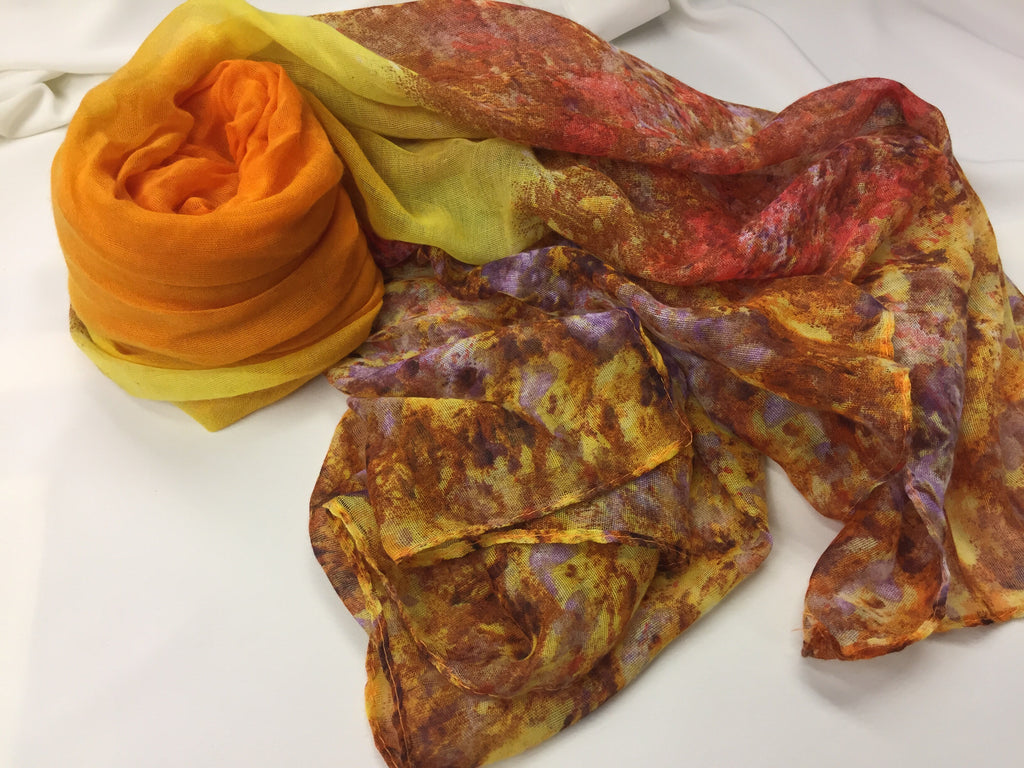 orange and yellow hijab with floral mixed print at the ends