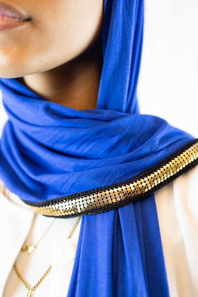 royal blue jersey hijab embellished with a gold trim along the edges