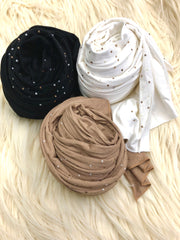 three jersey hijabs bundled together in taupe, white, and black and embellished with white and gold pearls