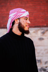 man wearing shmagh keffiyeh hatta wrapped around his head