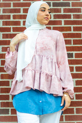 muslim woman wearing a white chiffon hijab and denim shirt extender with buttons