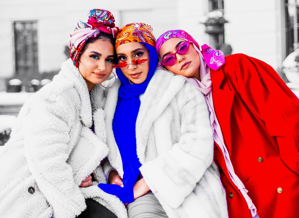 three muslim women wearing satin square printed hijabs as the bandana style and chiffon hijabs