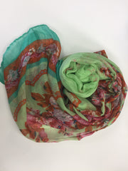 lime green hijab with edges of floral print in light pink, red, and orange